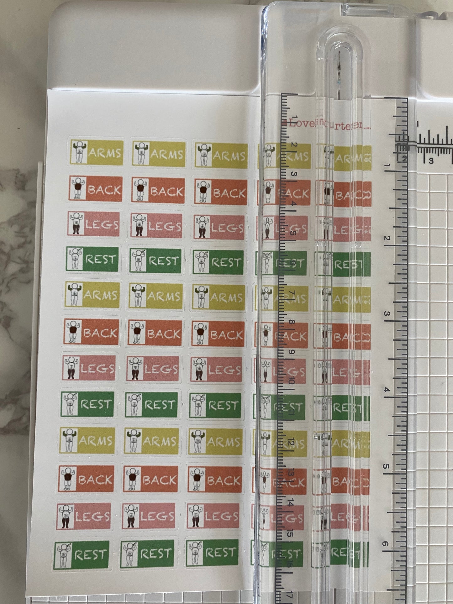 Workout journal sticker with a ruler to show the overall size of the sheet
