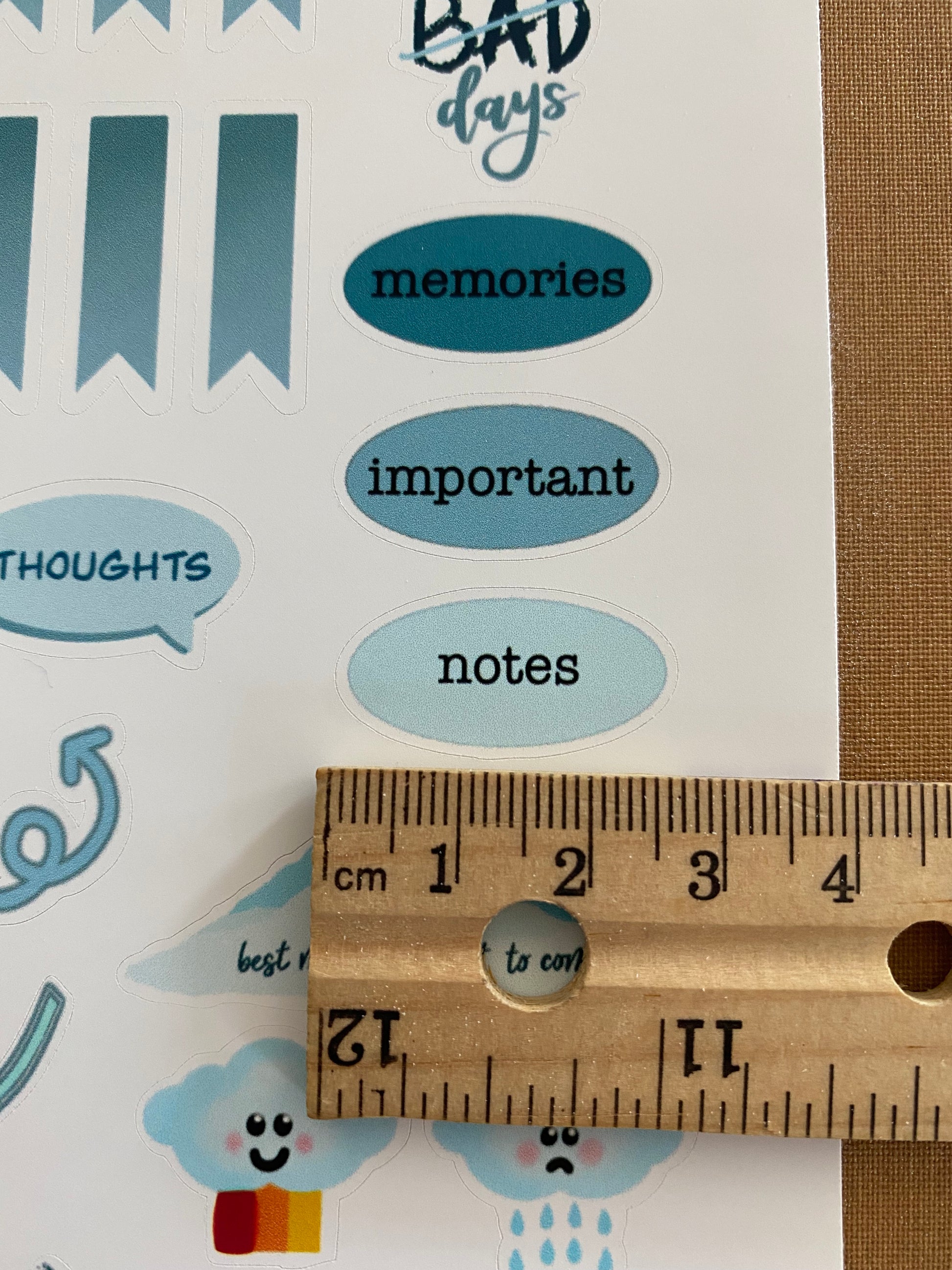 Blue color theme journal sticker sheet with a ruler to show the size of the "notes" sticker