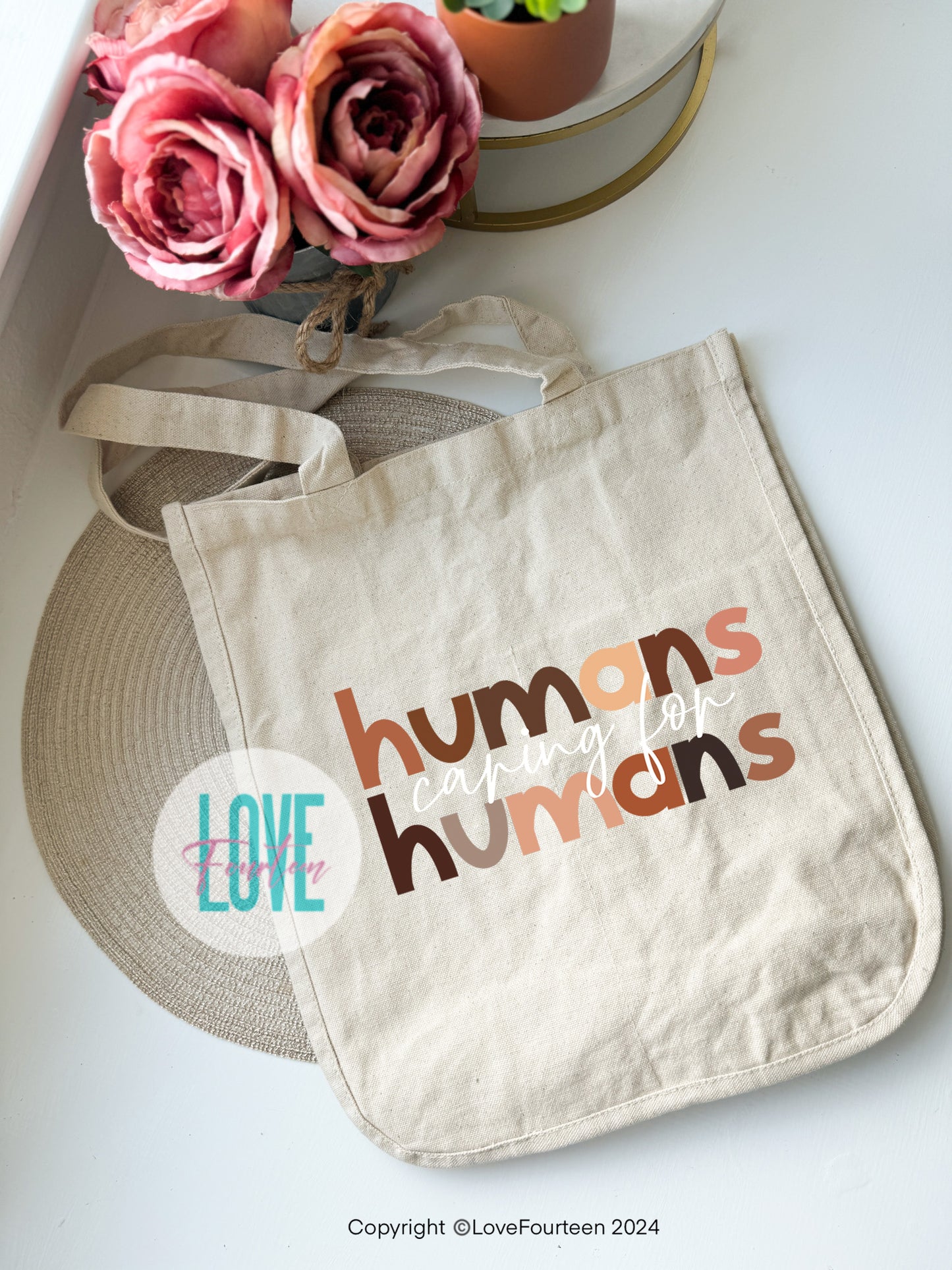Humans caring for humans Tote Bag