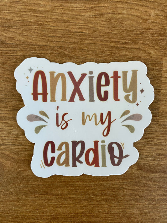 white variant of a waterproof die cut sticker on the table saying "anxiety is my cardio"