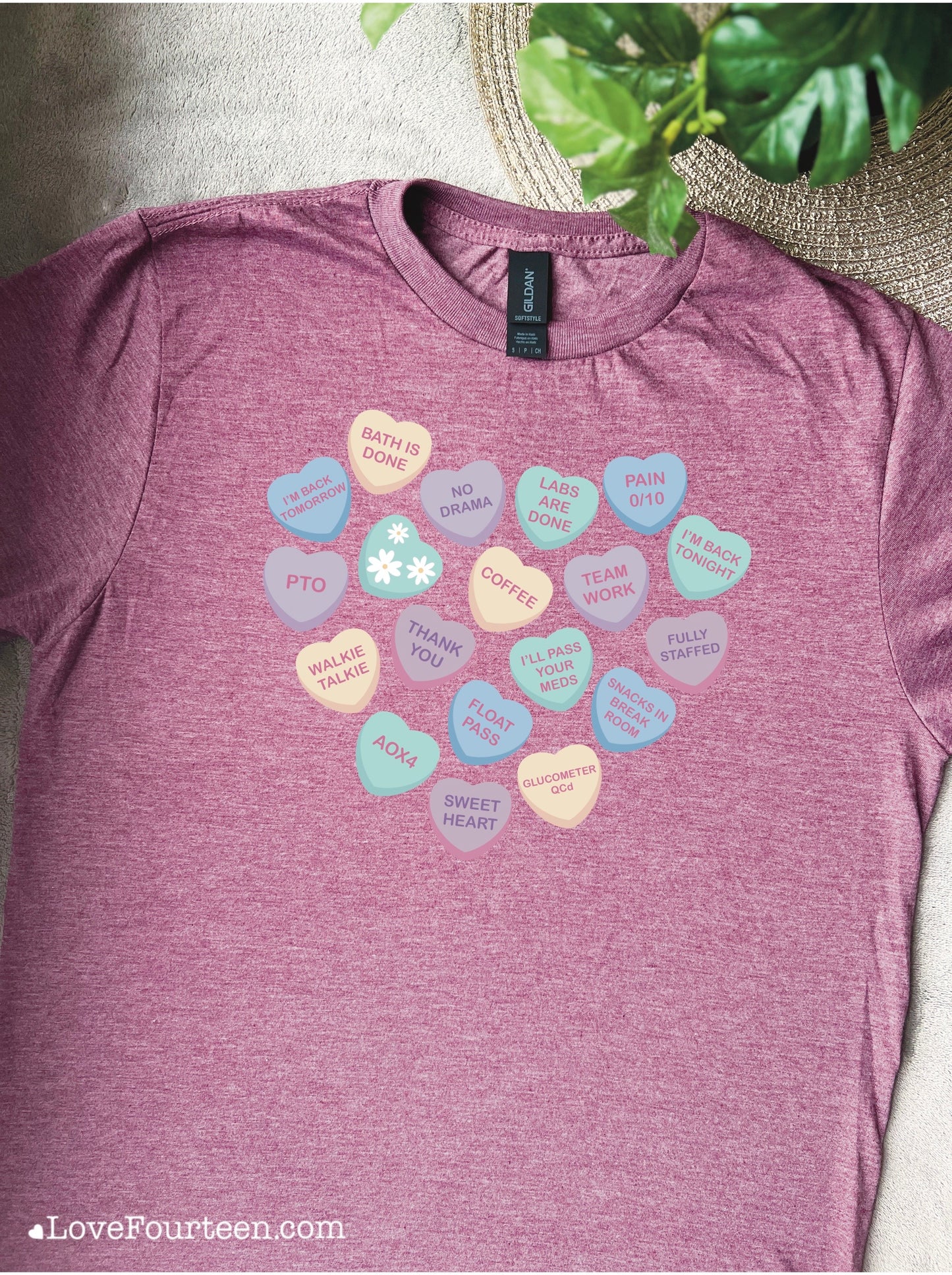 Maroon t-shirt with a candy heart print for healthcare workers