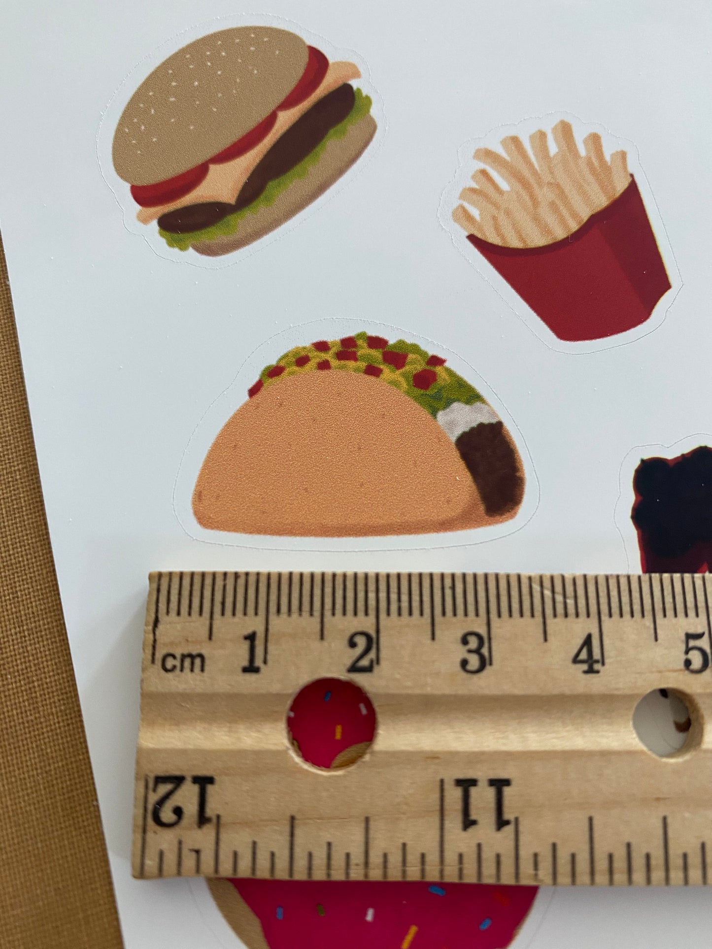Showing the size of each journal sticker. It shows a ruler underneath the tacos sticker