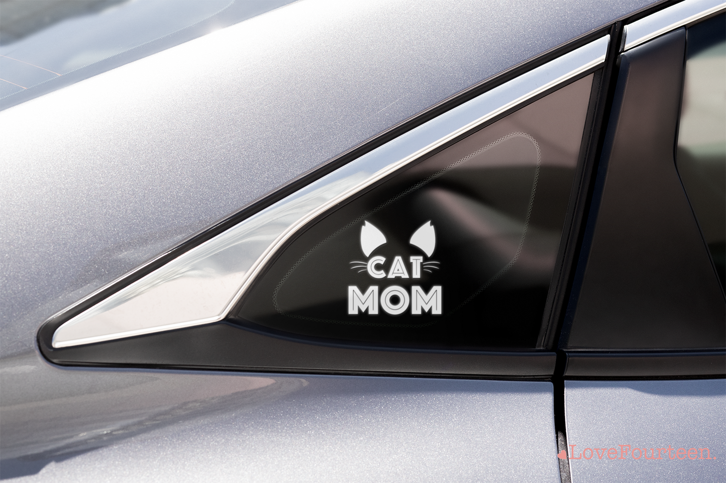 white cat mom vinyl sticker placed on the side glass of a car